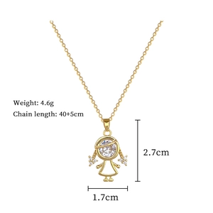 Detail view of a gold girl pendant necklace with diamond accents and specific size markers