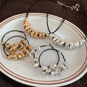 Unique twisted metal hoop necklace and earring jewelry set in gold and silver finish