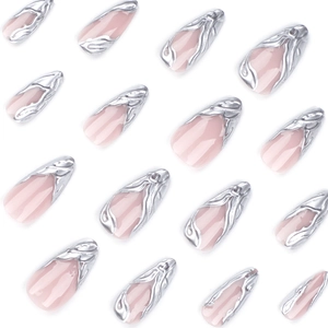 French almond press-on nails in nude pink with 3D silver embossed flowing textures