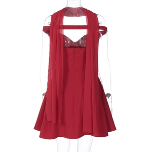 Back view of a red mini dress with an open-back design and long elegant streamers