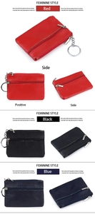Detail view of genuine leather coin pouches with key rings in red, black and blue colors