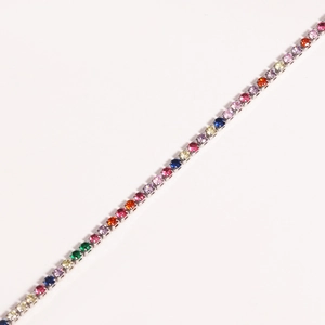 Detail view of colorful round-cut cubic zirconia tennis bracelet with silver prong setting