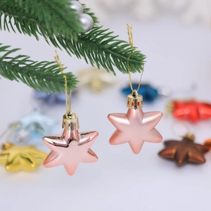 5cm colorful hexagonal star ornaments with metallic finish hanging on a Christmas tree branch