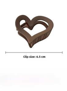 Detail view of the brown acrylic heart hair claw clip showing 6.5cm length measurement