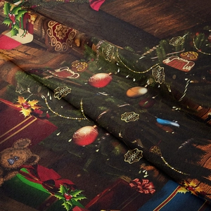 Detail of Christmas tapestry fabric showing festive prints with soft textile texture
