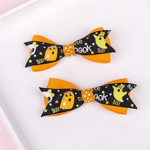 Close-up of Halloween orange and black grosgrain ribbon bows with ghost patterns