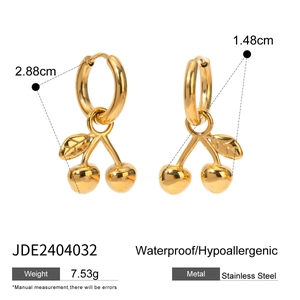 Detail view of golden cherry earrings in stainless steel with size and weight specs