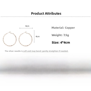 Detailed view of 4cm rose gold twisted hoop earrings with textured geometric facets