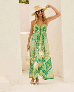 Detail of floral printed bohemian maxi dress with deep V-neck and tiered hem design