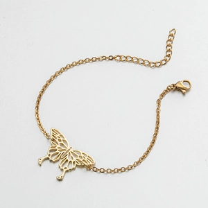 Detail of gold butterfly cutout pendant with fine chain link and adjustable lobster clasp