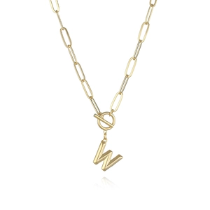 Detail of gold paperclip chain necklace with toggle clasp and 3D letter W pendant