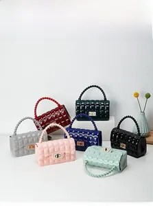 Detail showing various colors of quilted PVC jelly bags with gold metal square locks