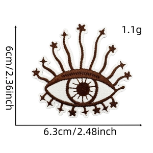 Detailed embroidery texture of an eye-shaped bohemian patch with 6.3x6cm dimensions