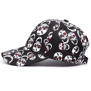 Black baseball cap featuring all-over skull print with red eyes for Halloween punk style