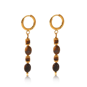 Detail of vintage gold hoop earrings with tiger eye stone beads and metallic tassels