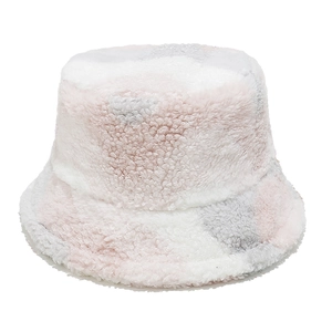Close-up of plush bucket hat featuring pink, grey and white faux lamb wool patchwork