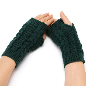 Women's green knitted fingerless gloves with cable knit texture for winter warmth