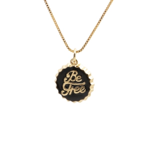 Golden 18K plated necklace featuring a black round bottle cap pendant with Be Free text