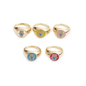 Detail of five adjustable evil eye rings with colorful enamel palm designs and zircon