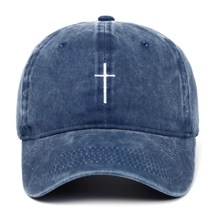 Navy blue washed denim baseball cap featuring a white embroidered cross on the front