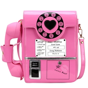 Detail of pink vintage telephone bag showing the heart-shaped dial and retro lettering