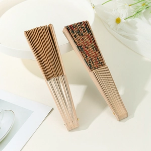 Detail of closed Portuguese cork folding fans with plain and painted floral patterns
