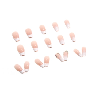 Elegant medium-length ballerina false nails with nude gradient and rhinestone accents