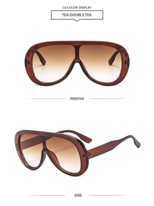 Detailed views of oversized tea shield sunglasses with gradient lenses from front and side