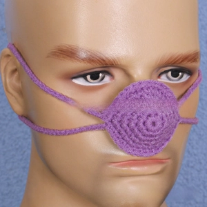 Detail view of purple crochet nose warmer on mannequin for winter outdoor funny props