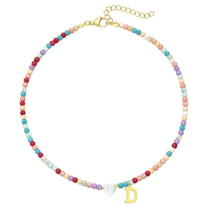 Colorful beaded necklace with shell heart and golden letter D pendant on white background