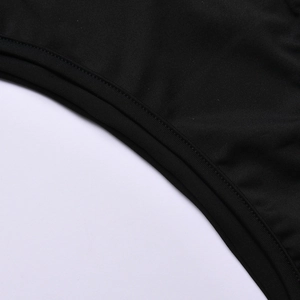 Close-up of smooth black synthetic fabric with premium stitching detail on swimsuit