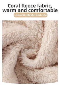 Close-up of thick beige coral fleece fabric texture showing soft plush material
