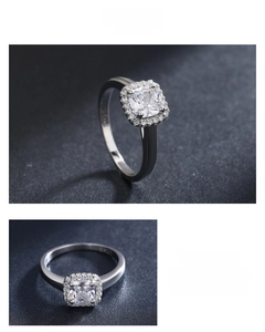 Macro detail of S925 sterling silver ring with square-cut zircon and halo pavé setting