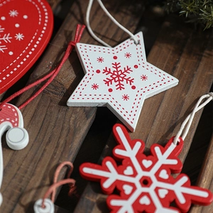 Christmas wooden hanging ornaments with red and white stars, hearts and snowflakes patterns