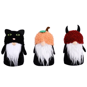 Three Halloween gnomes set with pumpkin and black cat hats for holiday table decor
