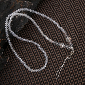 Detailed shot of multi-faceted crystal beads phone strap with sturdy metal clasp