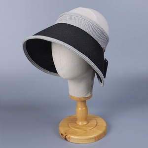 Detail of a foldable wide brim sun visor with textured weaving and two-tone拼接 design