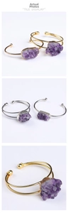 Detailed view of raw druzy amethyst stones on adjustable gold and silver plated bracelets