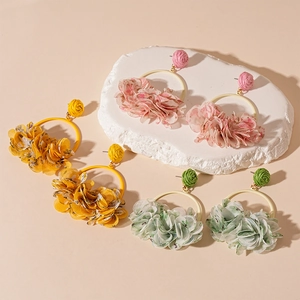 Chic fabric flower earrings in yellow, pink and green with woven stud details