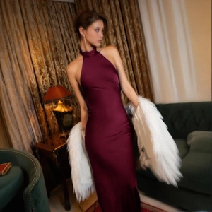 Elegant burgundy satin halter dress with faux fur shawl for formal evening parties