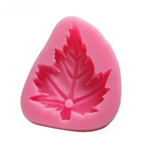 Detail view of pink silicone maple leaf mold with realistic vein textures for baking