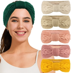 Detail showing various colors of cable knit headbands with soft fleece lining