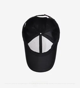 Detail shot of black baseball cap interior showing mesh structure and stitching