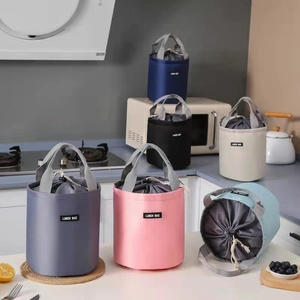 Insulated cylindrical lunch bag with drawstring closure and handle in various colors