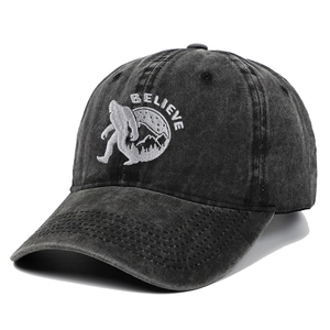 Vintage washed black baseball cap with white Bigfoot and Believe embroidery detail