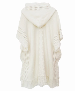 Back view of a white knitted hooded poncho featuring delicate bohemian tassel edges