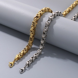 Detail of 8mm titanium steel Byzantine chains with lobster clasp in gold and silver