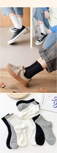 Detailed knit texture of white black and grey cotton crew socks in four grid views