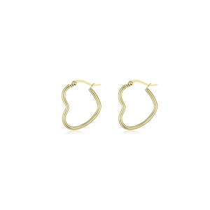 Detailed macro view of gold-plated stainless steel heart hoop earrings with polished finish