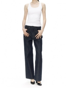 Detail of high waist wide leg dark blue denim jeans paired with a white rib-knit tank top